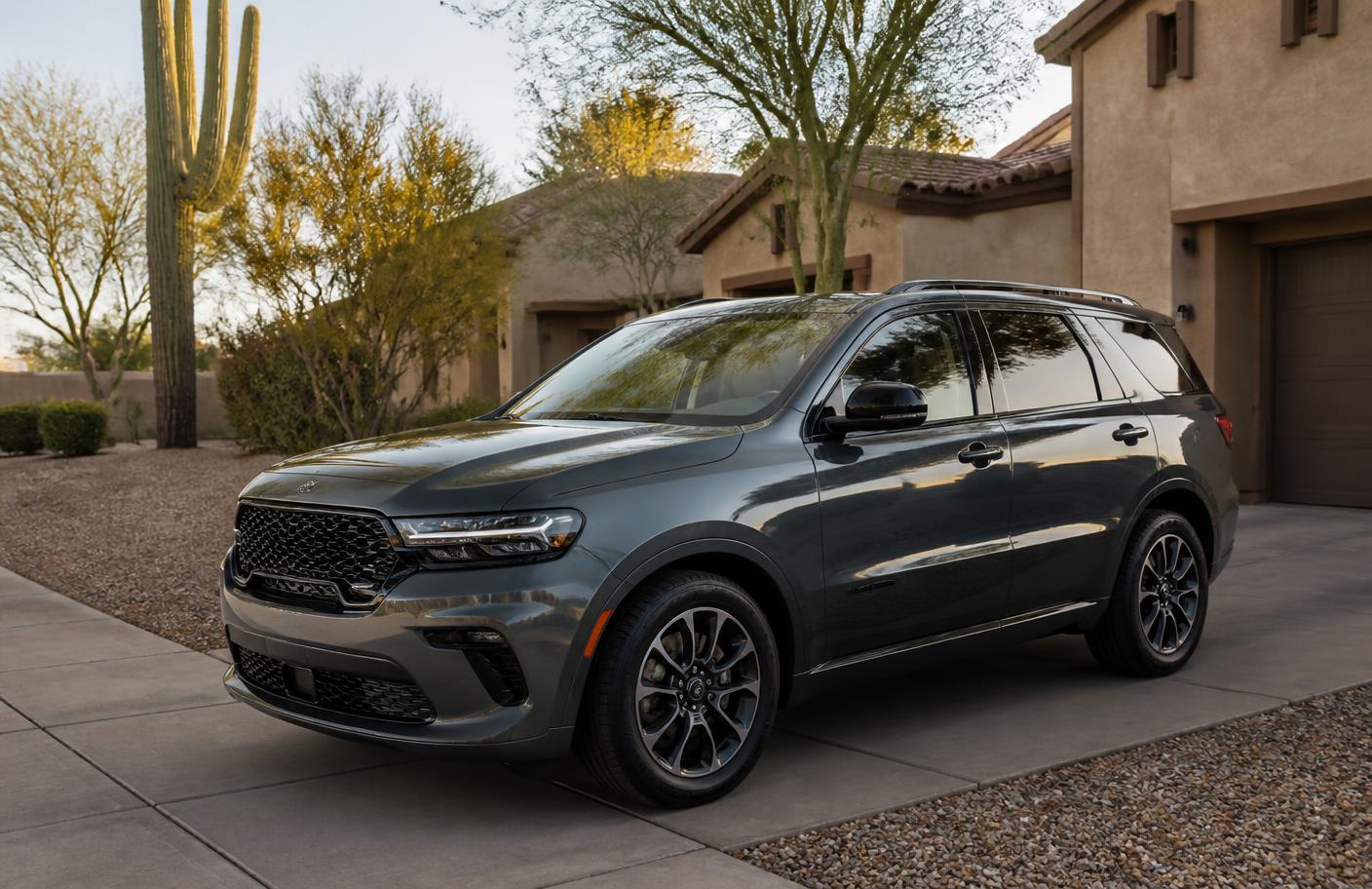 Freshly coated dark gray SUV with glossy paint parked in the shaded driveway of a Phoenix desert home